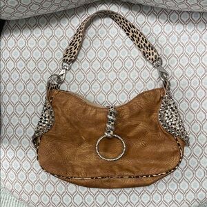 Tan purse with leopard print trim and handle
